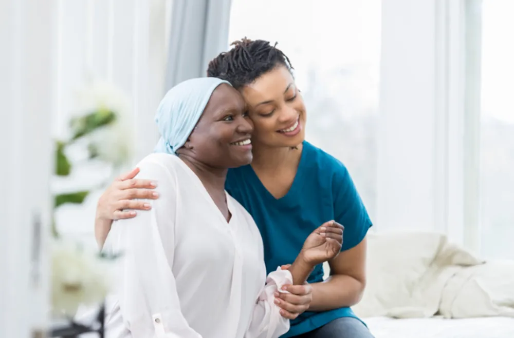A NJ TLC caregiver embracing a client with warmth